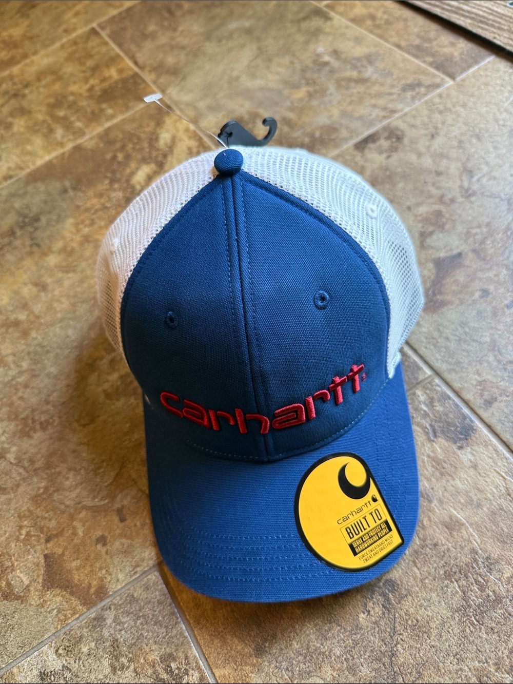 Carhartt Navy & Cream Mesh Back Logo Trucker Hat with red embroidered logo